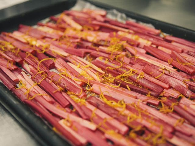 Rhubarb lines a baking tray for catering courses